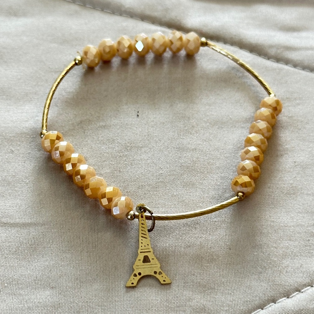 Gold Tone & Crystal beaded, stretchy charm bracelet w/Eiffel Tower charm